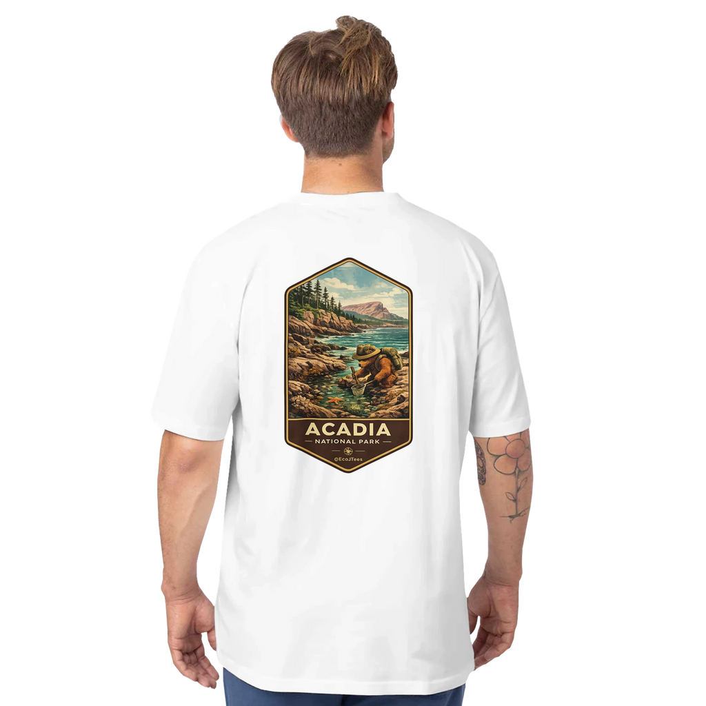 Person wearing a white t-shirt with a scenic graphic and 'Acadia National Park' text on the back.