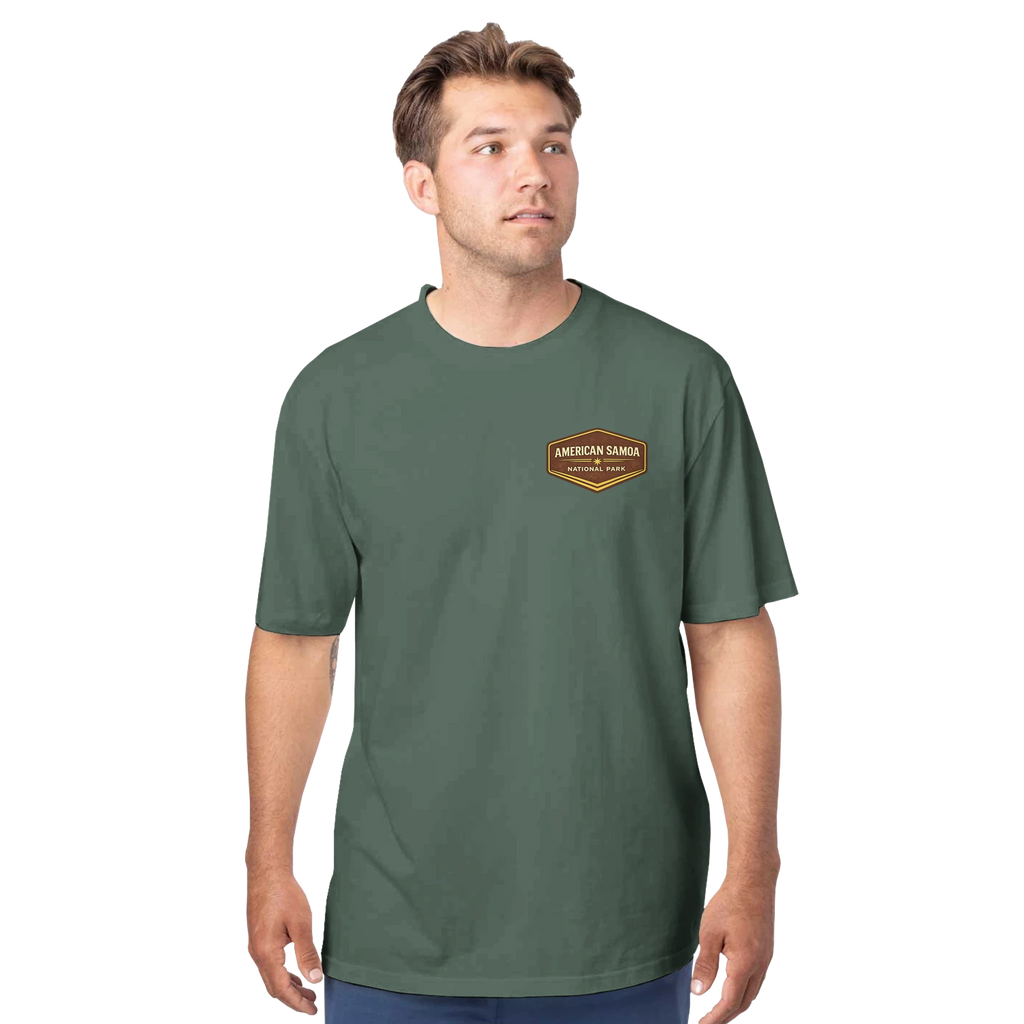 Man wearing a green t-shirt with a logo on a white background