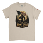 Beige t-shirt with a graphic of Bigfoot holding an American flag and '250 Years of Freedom' text on a white background.