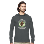 Man wearing a dark gray Bigfoot eco hoodie with a graphic design on a white background