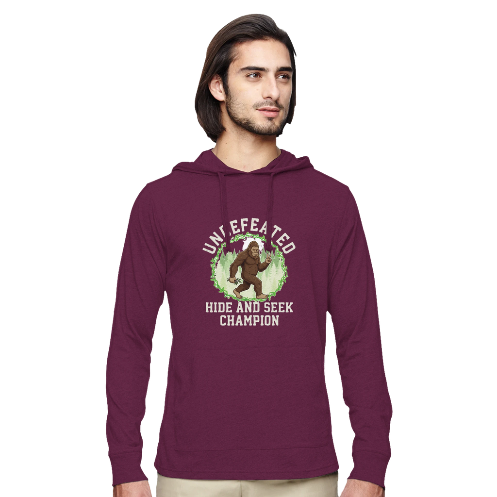 Man wearing a maroon Bigfoot hoodie with a graphic design on a white background