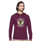 Man wearing a maroon Bigfoot hoodie with a graphic design on a white background
