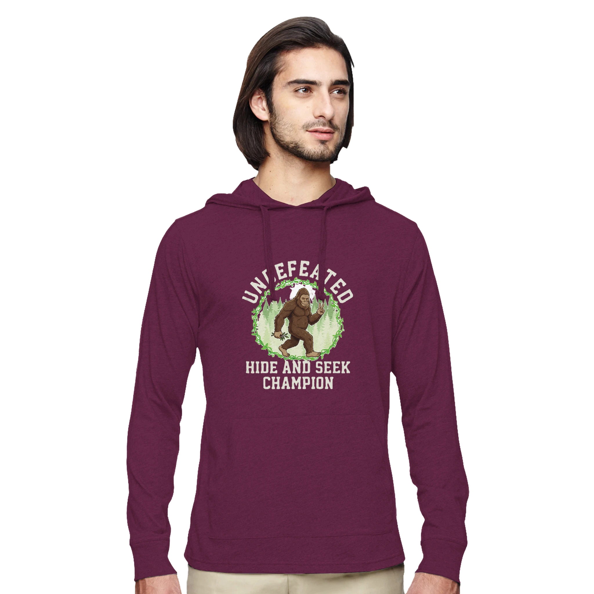 Man wearing a maroon Bigfoot hoodie with a graphic design on a white background