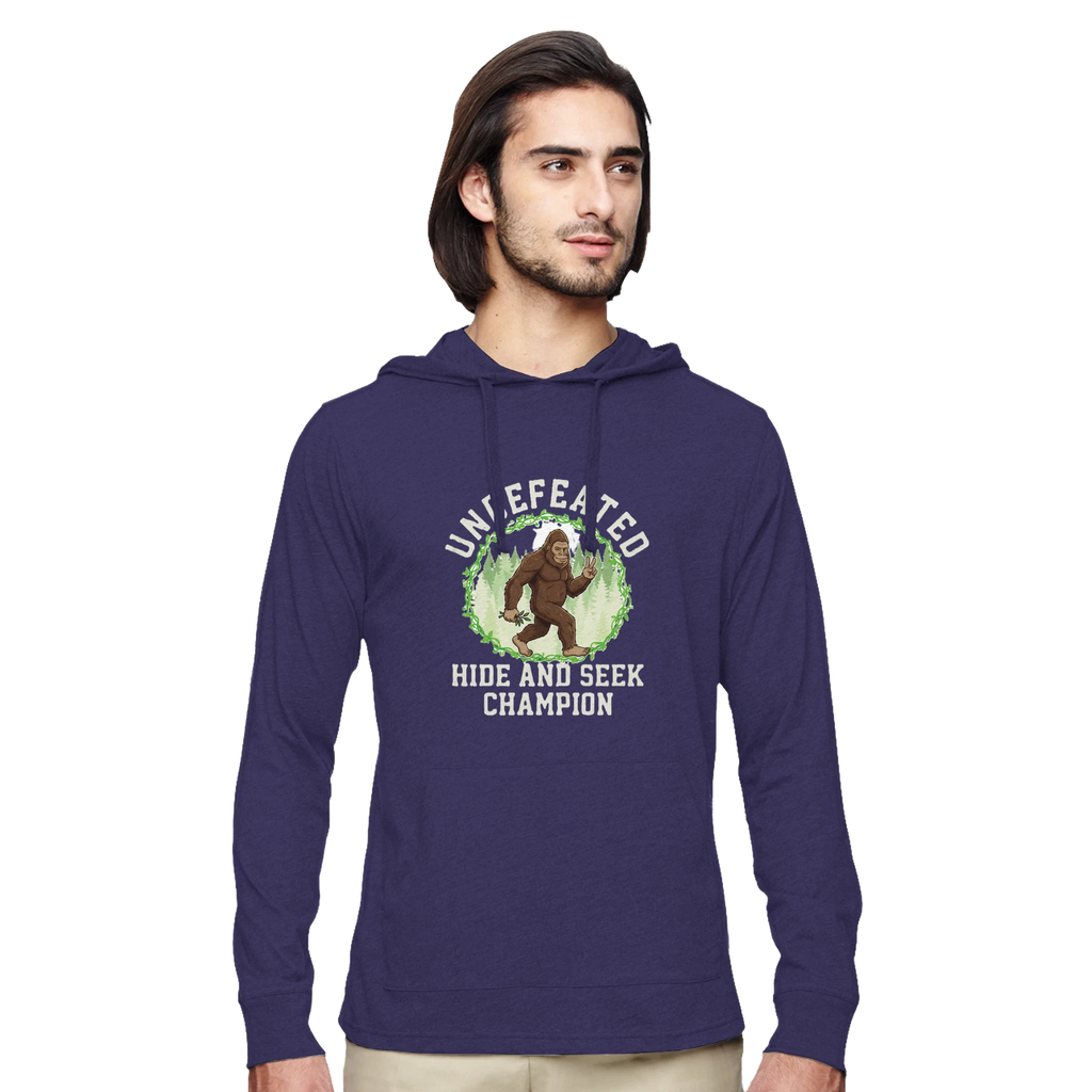 Man wearing a purple hoodie with a Bigfoot graphic design on a white background