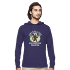 Man wearing a purple hoodie with a Bigfoot graphic design on a white background