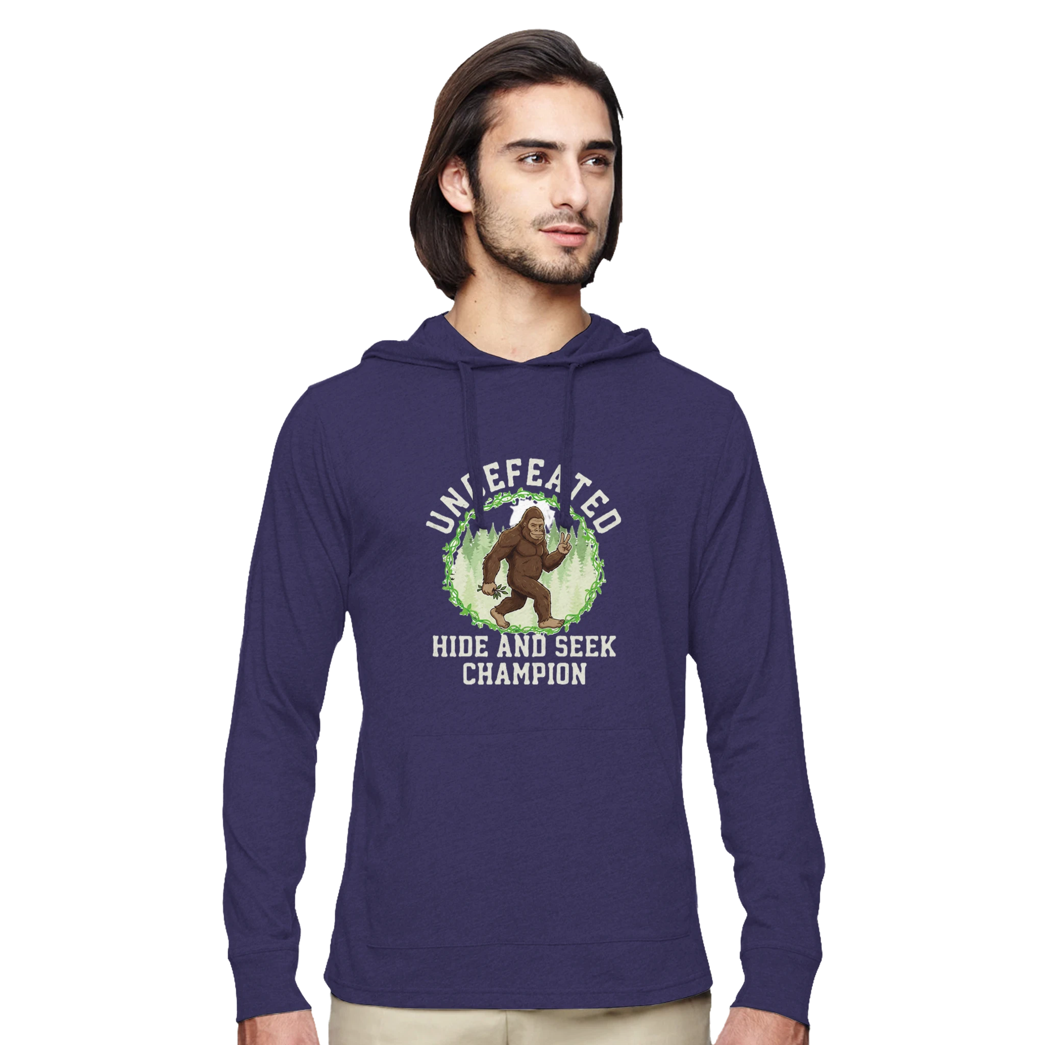 Man wearing a purple hoodie with a Bigfoot graphic design on a white background