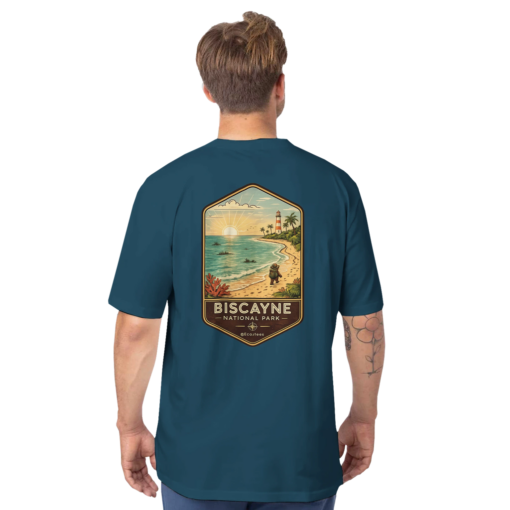 Man wearing a teal t-shirt with a beach graphic and 'Biscayne National Park' text on the back.