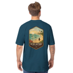 Man wearing a teal t-shirt with a beach graphic and 'Biscayne National Park' text on the back.