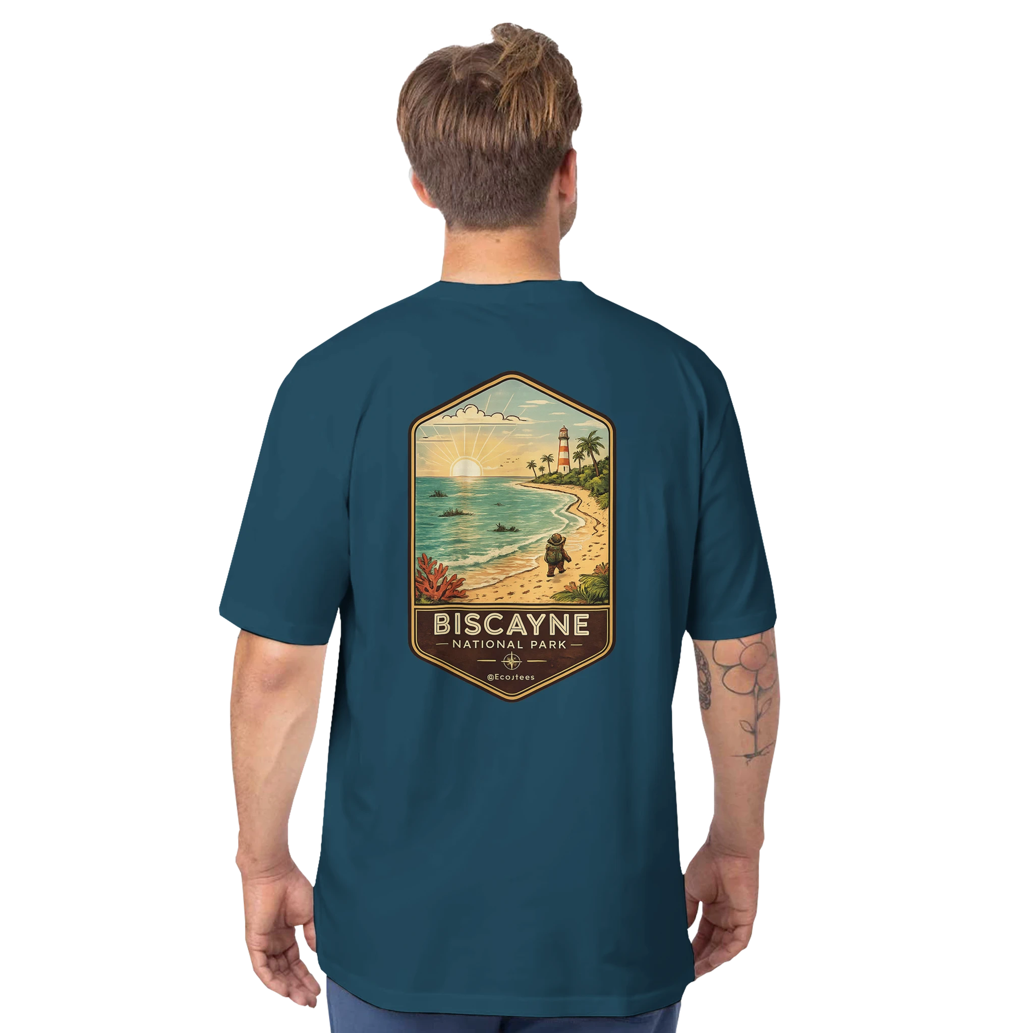 Man wearing a teal t-shirt with a beach graphic and 'Biscayne National Park' text on the back.