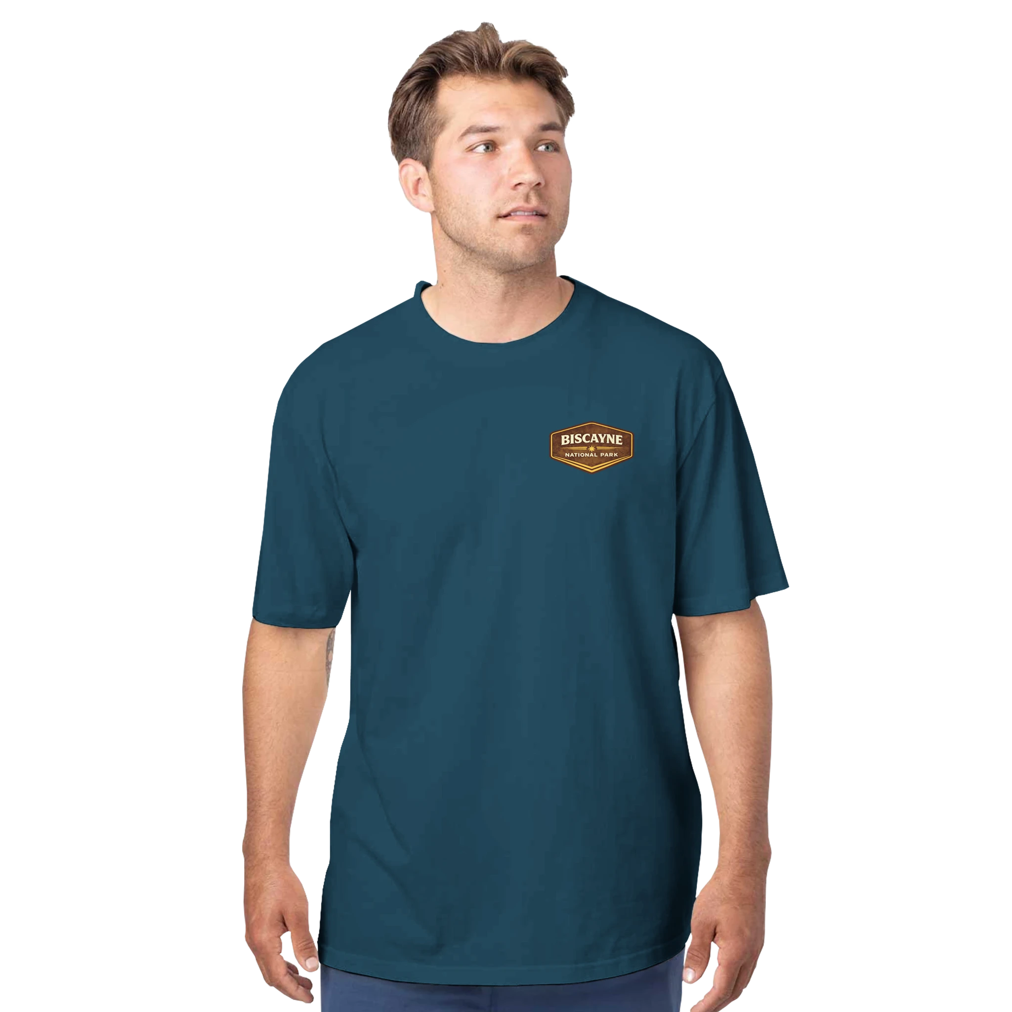 Man wearing a teal t-shirt with a logo on a white background