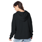 Person wearing a black hoodie from behind on a white background