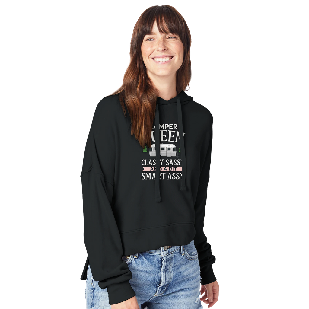 Woman wearing a black hoodie with Camper Queen text and graphics on a white background