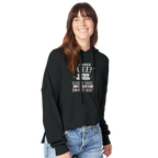 Woman wearing a black hoodie with Camper Queen text and graphics on a white background