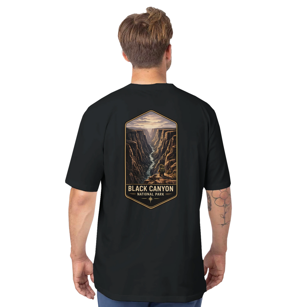 Person wearing a black t-shirt with 'Black Canyon National Park' design on the back