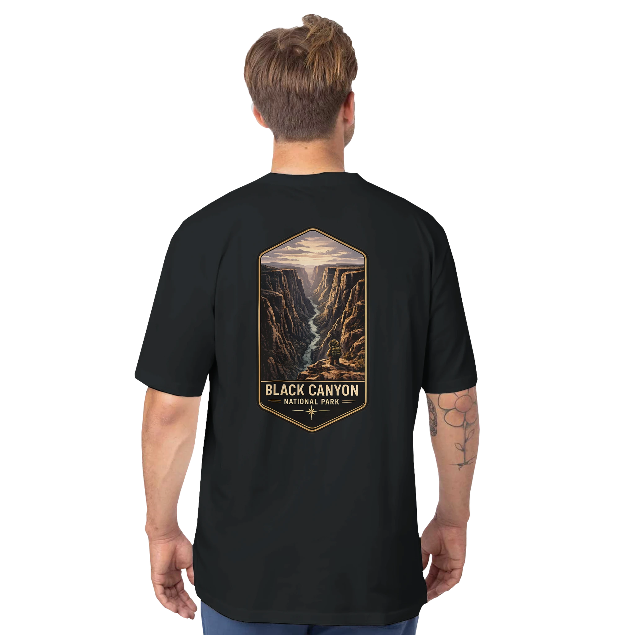 Person wearing a black t-shirt with 'Black Canyon National Park' design on the back