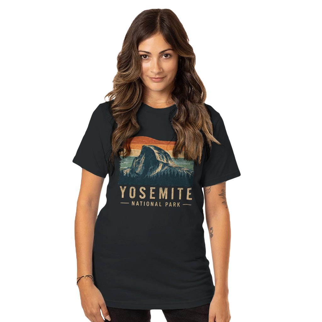 Woman in a black t-shirt with  Yosemite National Park graphic on a black background