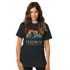 Woman in a black t-shirt with  Yosemite National Park graphic on a black background