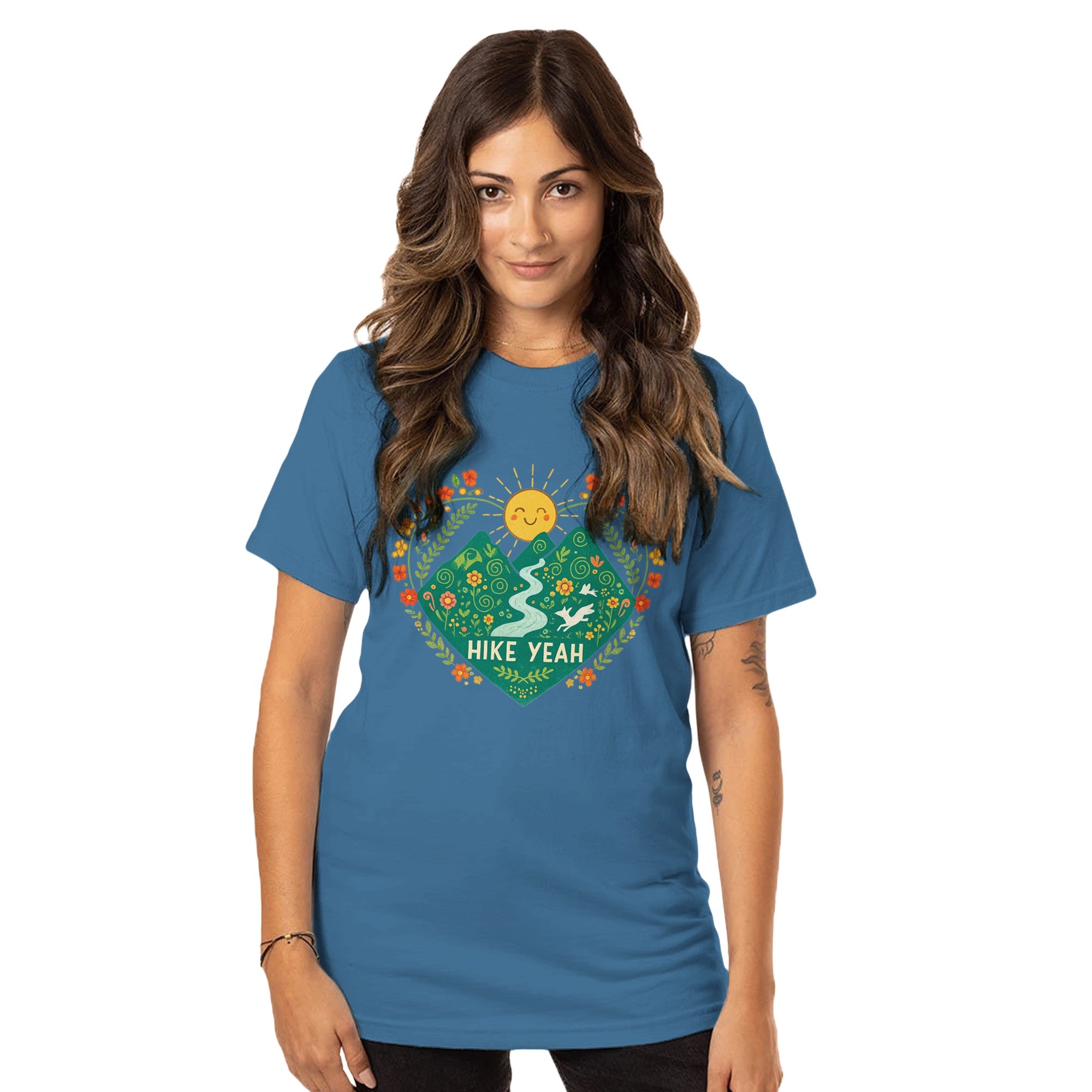 Woman wearing a blue t-shirt with a nature-themed design and text.