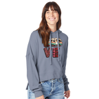 Woman wearing a gray hoodie with colorful 'LOVE' design from the Love Collection on a white background