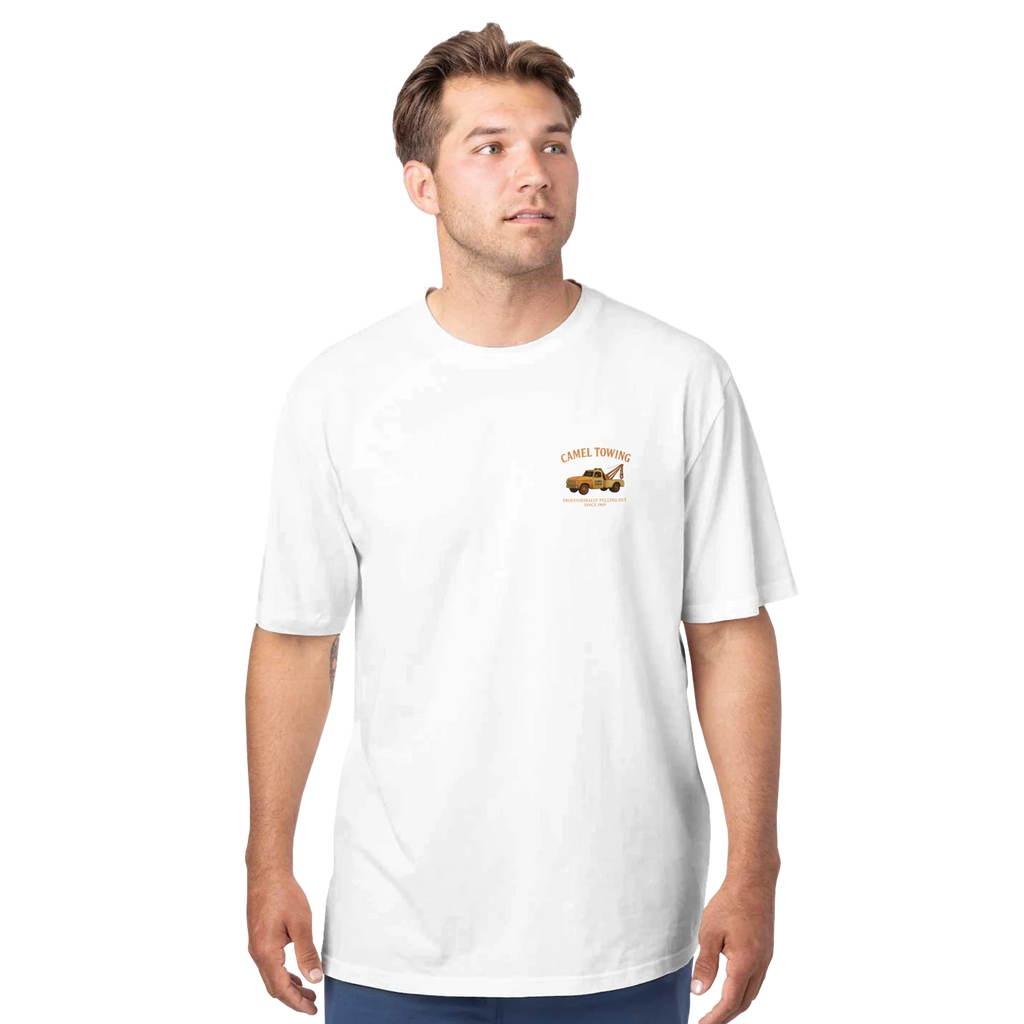 Man wearing a white t-shirt with a small Camel Towing graphic on a white background
