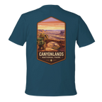 Teal t-shirt with Canyonlands National Park graphic on a white background
