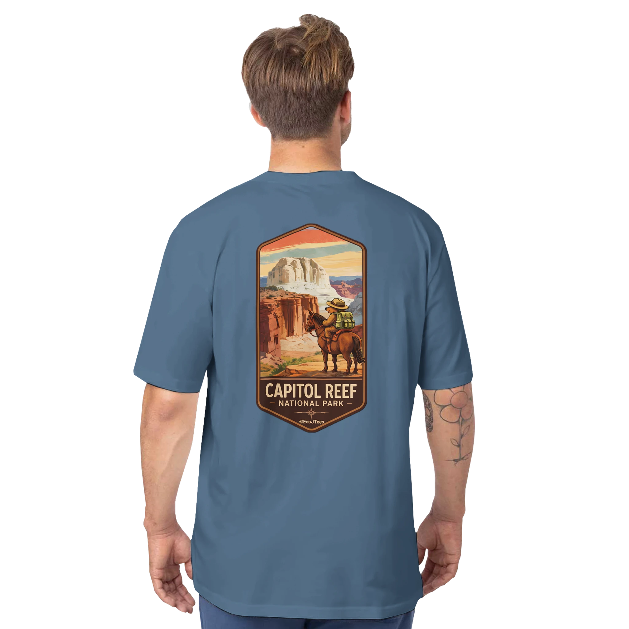 Man wearing a blue t-shirt with Capitol Reef National Park graphic on the back