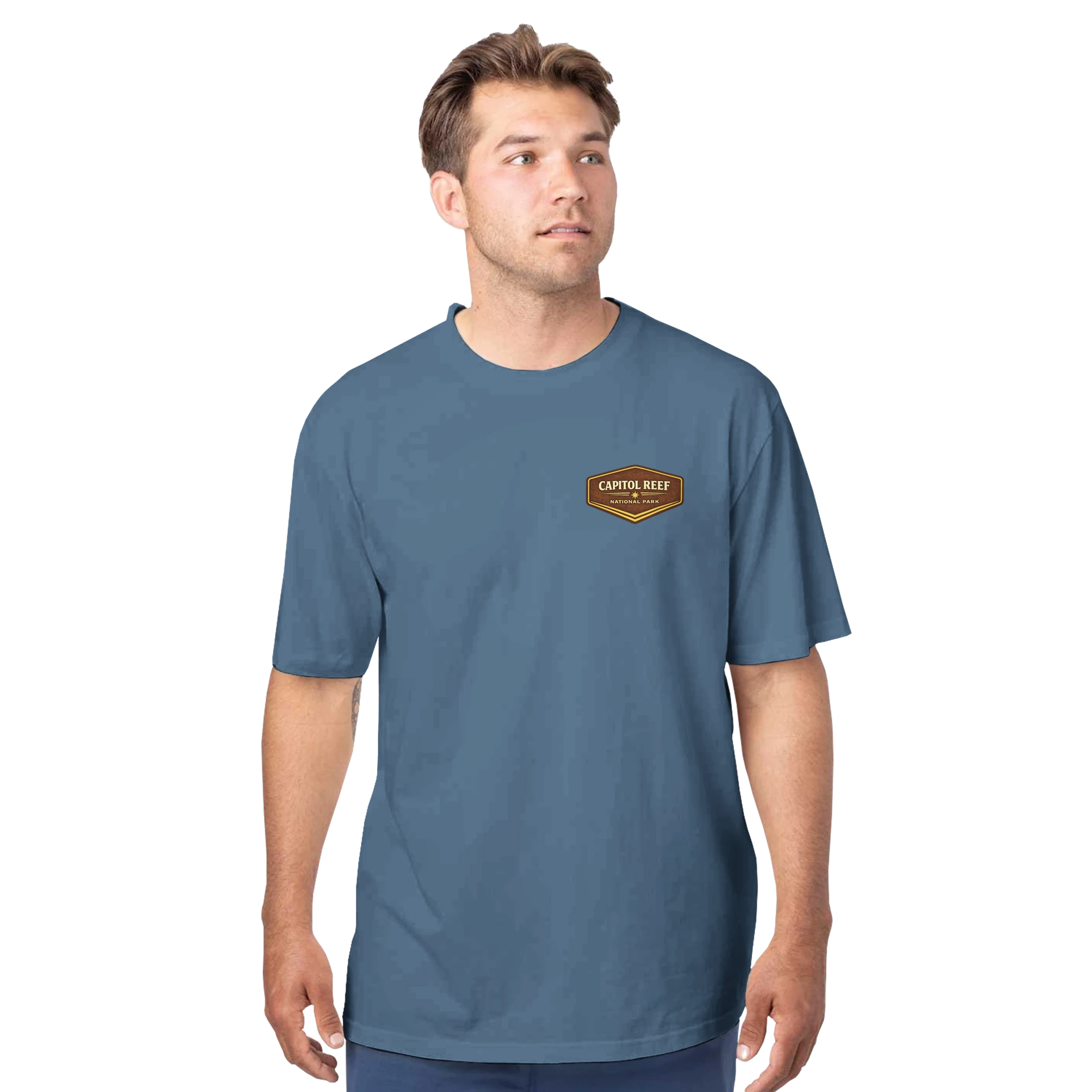 Man wearing a blue t-shirt with a logo on a white background