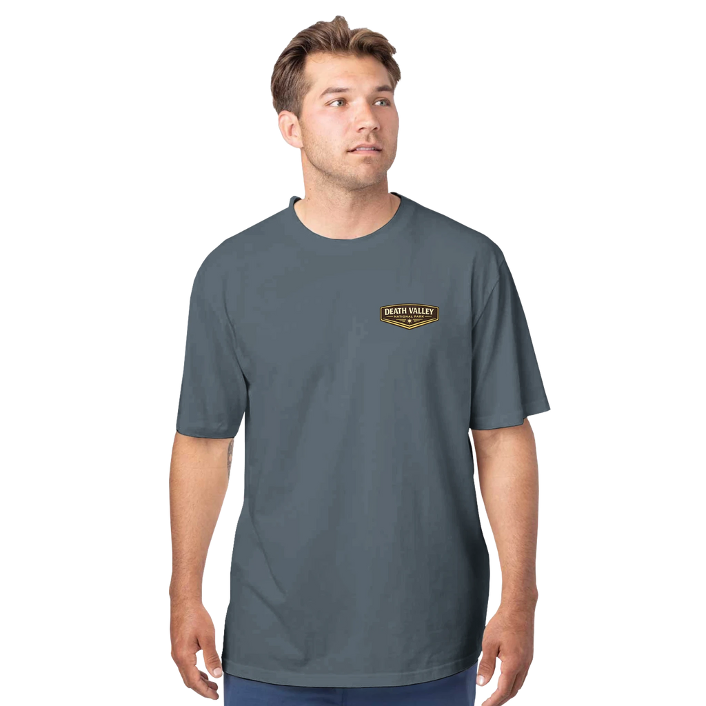 Man wearing a gray t-shirt with a Death Valley National Park logo on a white background