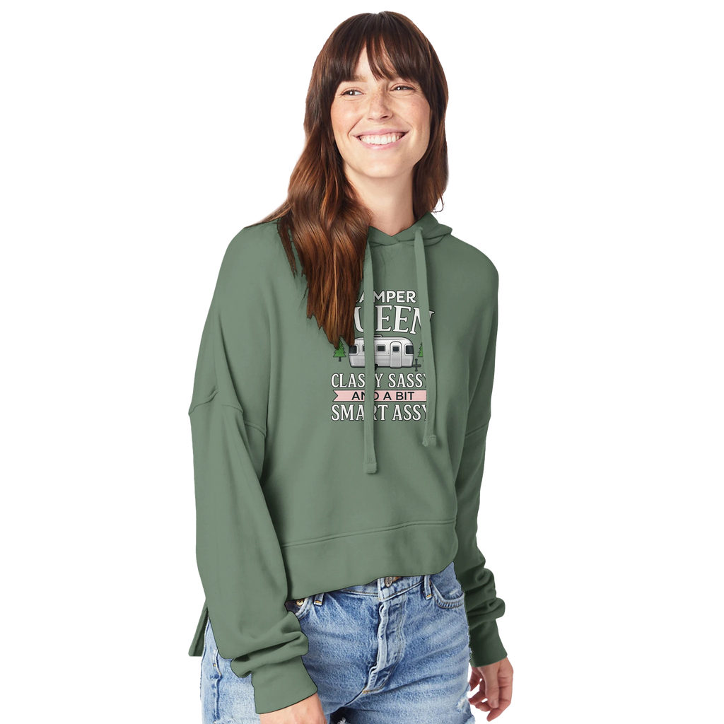Woman wearing a green hoodie with Camper Queen text and graphics on a white background