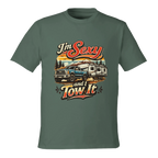 Green t-shirt with a graphic design of a truck and RV with text 'I'm Sexy and I Tow It' on a white background.