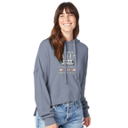 Woman wearing a gray hoodie with Camper Queen text and graphics on a white background