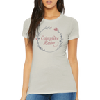 Woman wearing a light gray t-shirt with 'Campfire Babe' design on a white background
