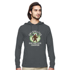 Man wearing a grey hoodie with a Bigfoot Graphic on a white background