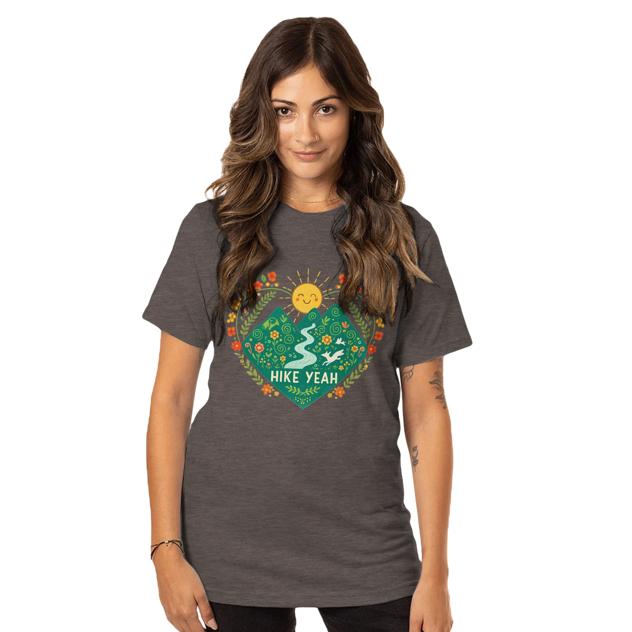 Woman wearing a dark gray t-shirt with a colorful graphic design on a white background
