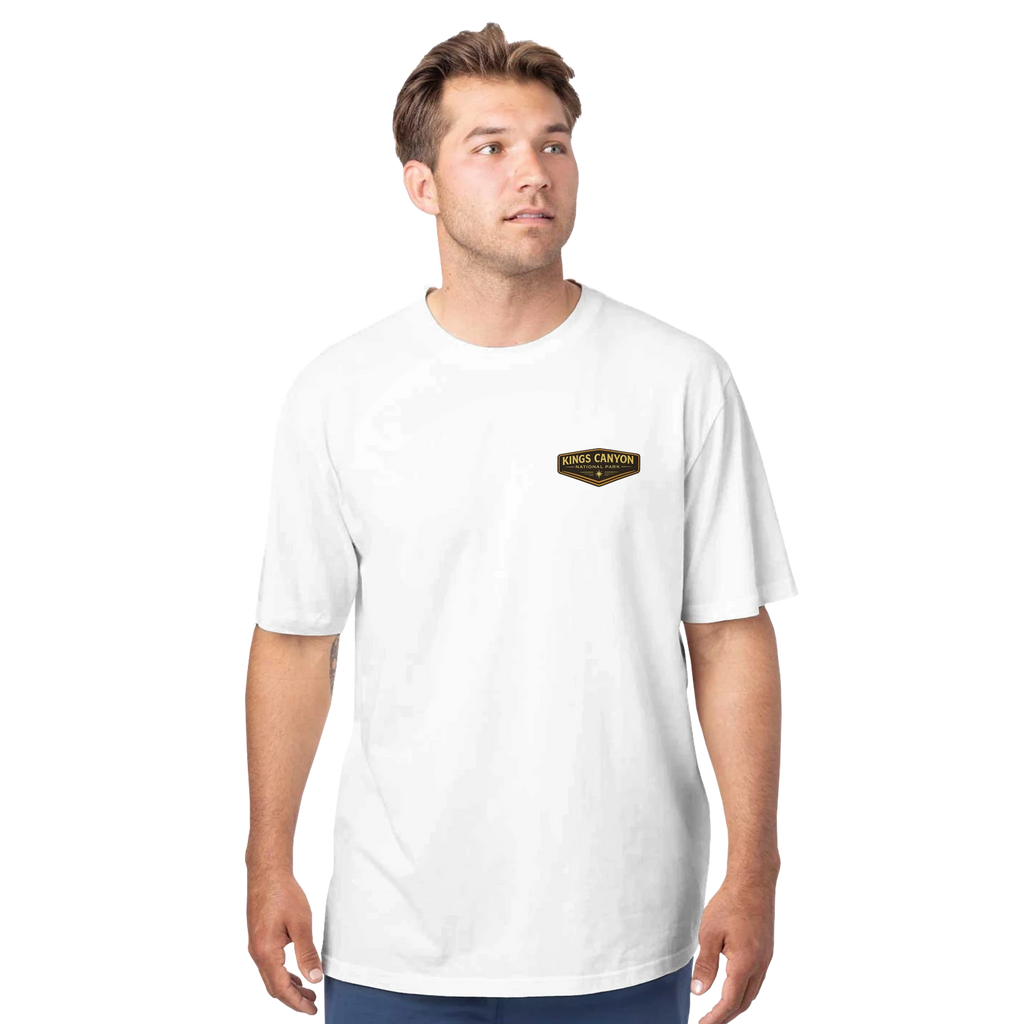 Man wearing a white t-shirt with a logo on a white background