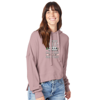 Woman wearing a pink Camper Queen hoodie with text and graphics on a white background