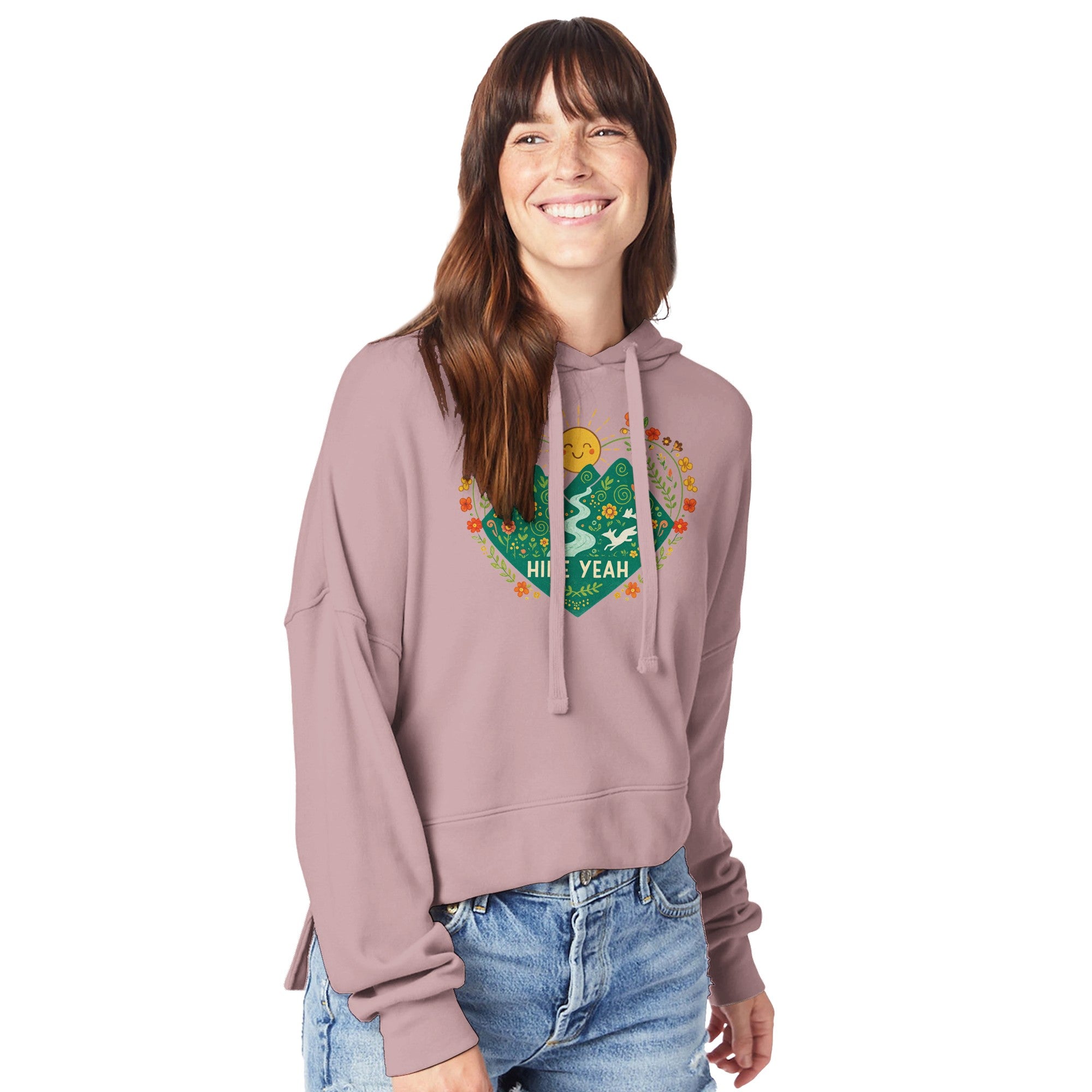 Woman wearing a pink hoodie with a graphic design on a white background