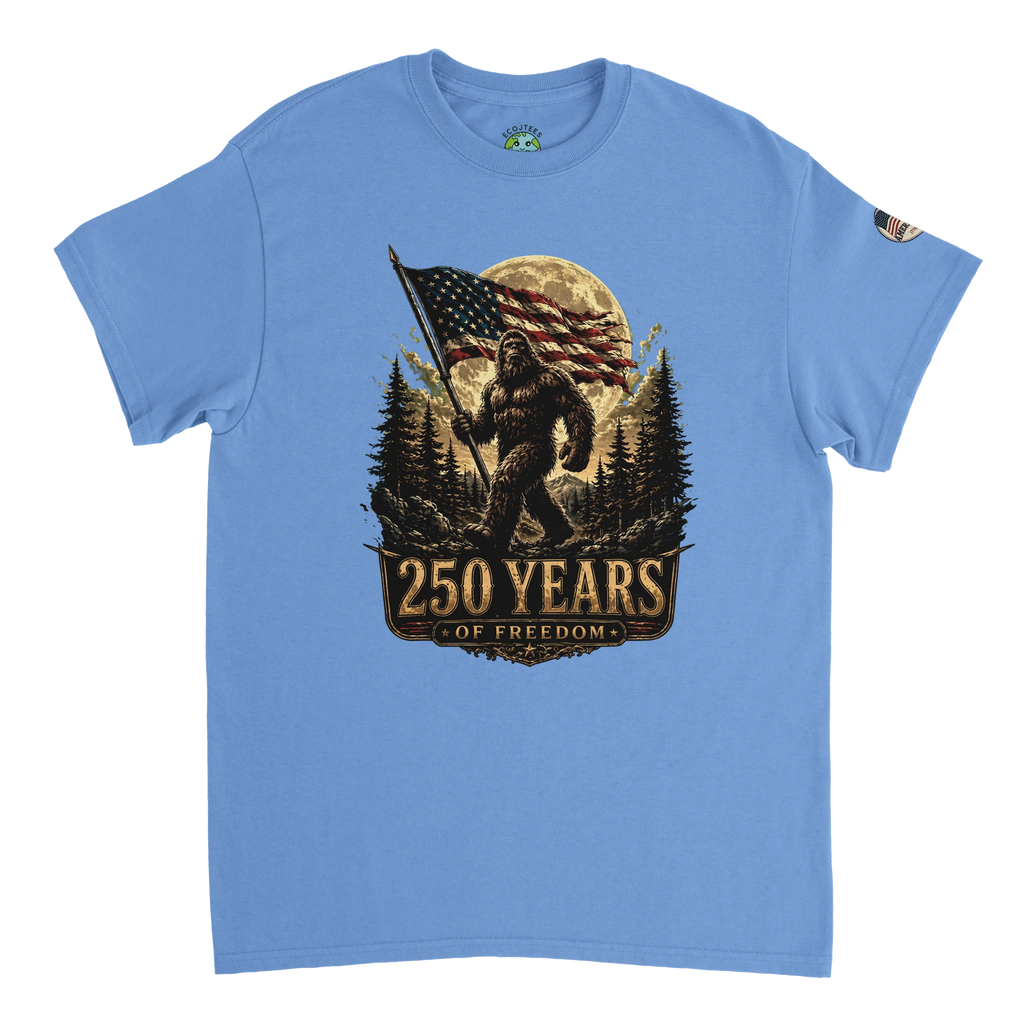 Blue t-shirt with a graphic of Bigfoot holding an American flag and '250 Years of Freedom' text on a white background.