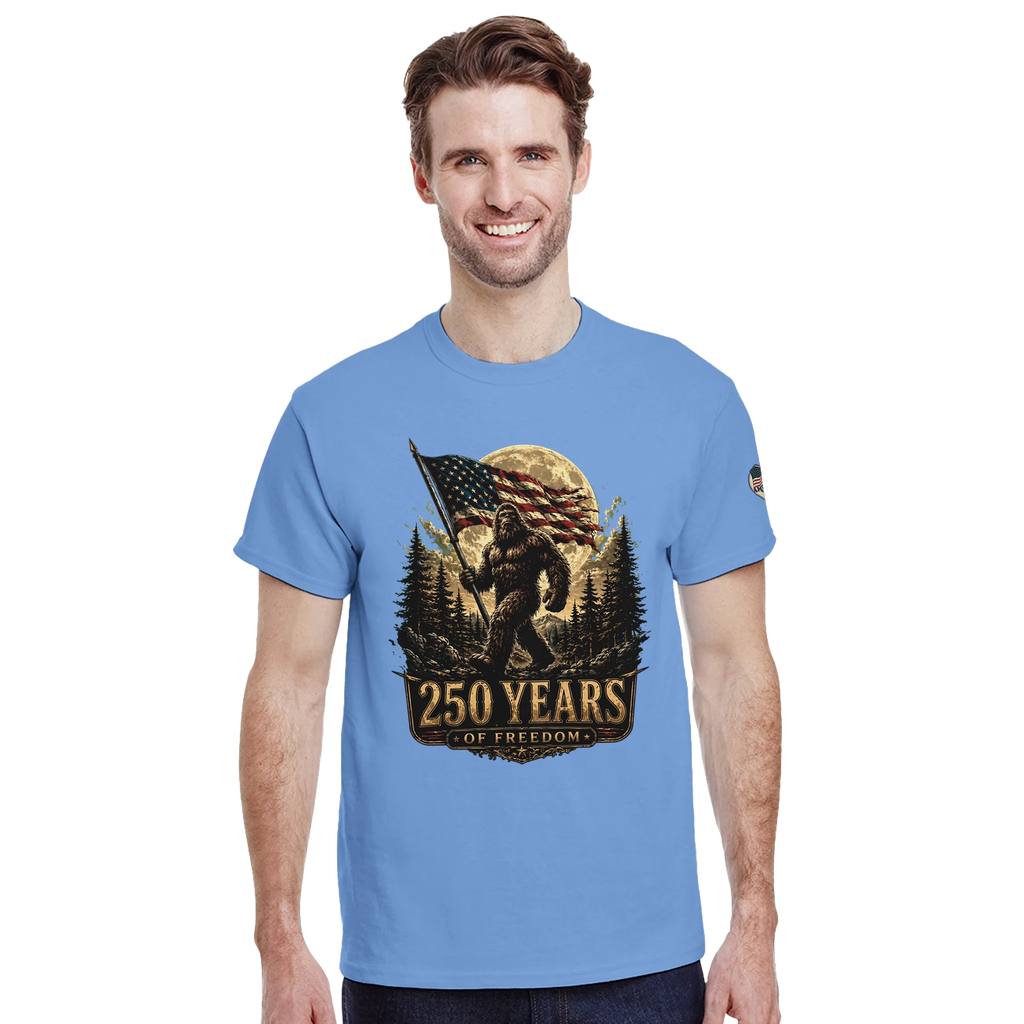 Man wearing a blue t-shirt with a Bigfoot graphic design on a white background