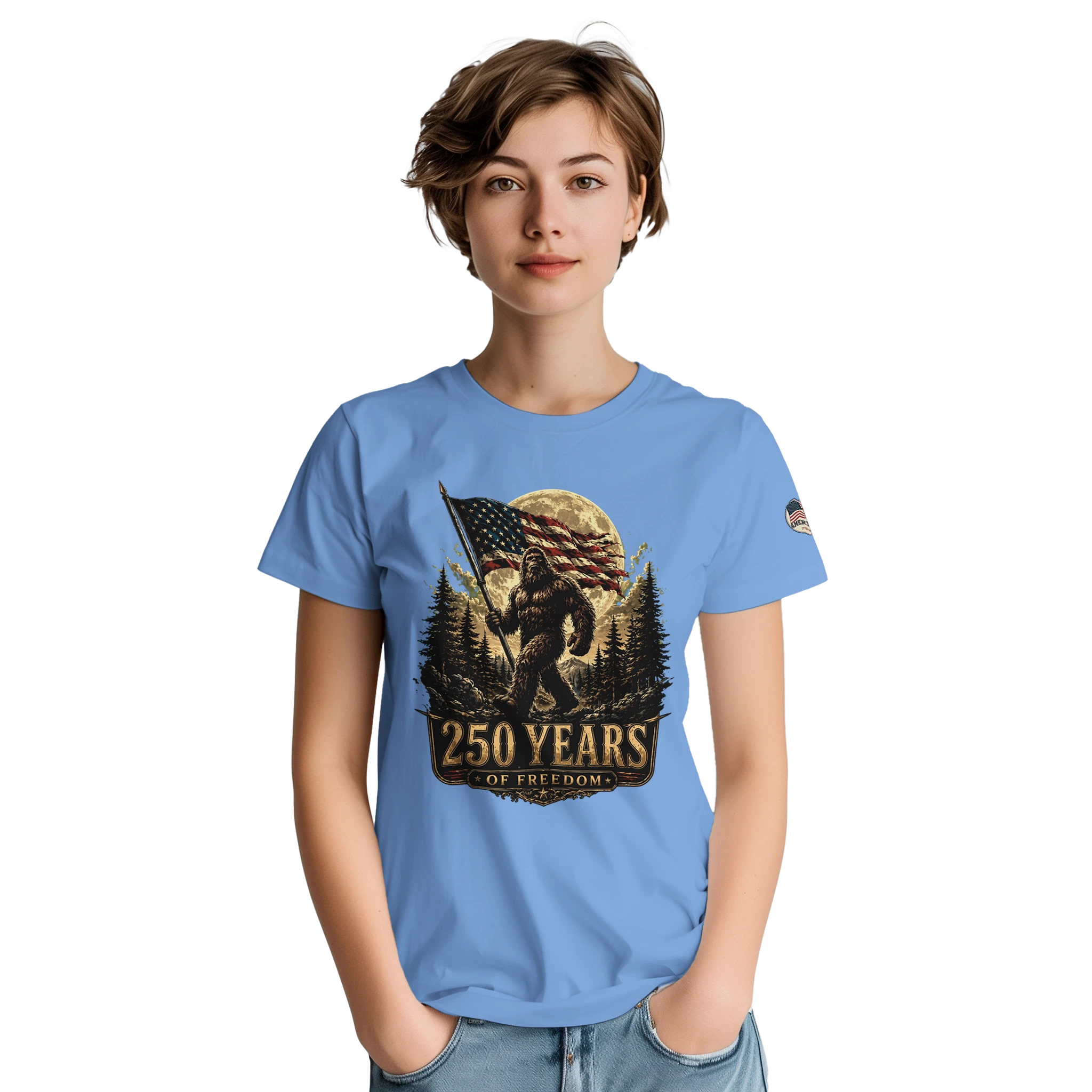 Woman wearing a blue t-shirt with a Bigfoot graphic design on a white background