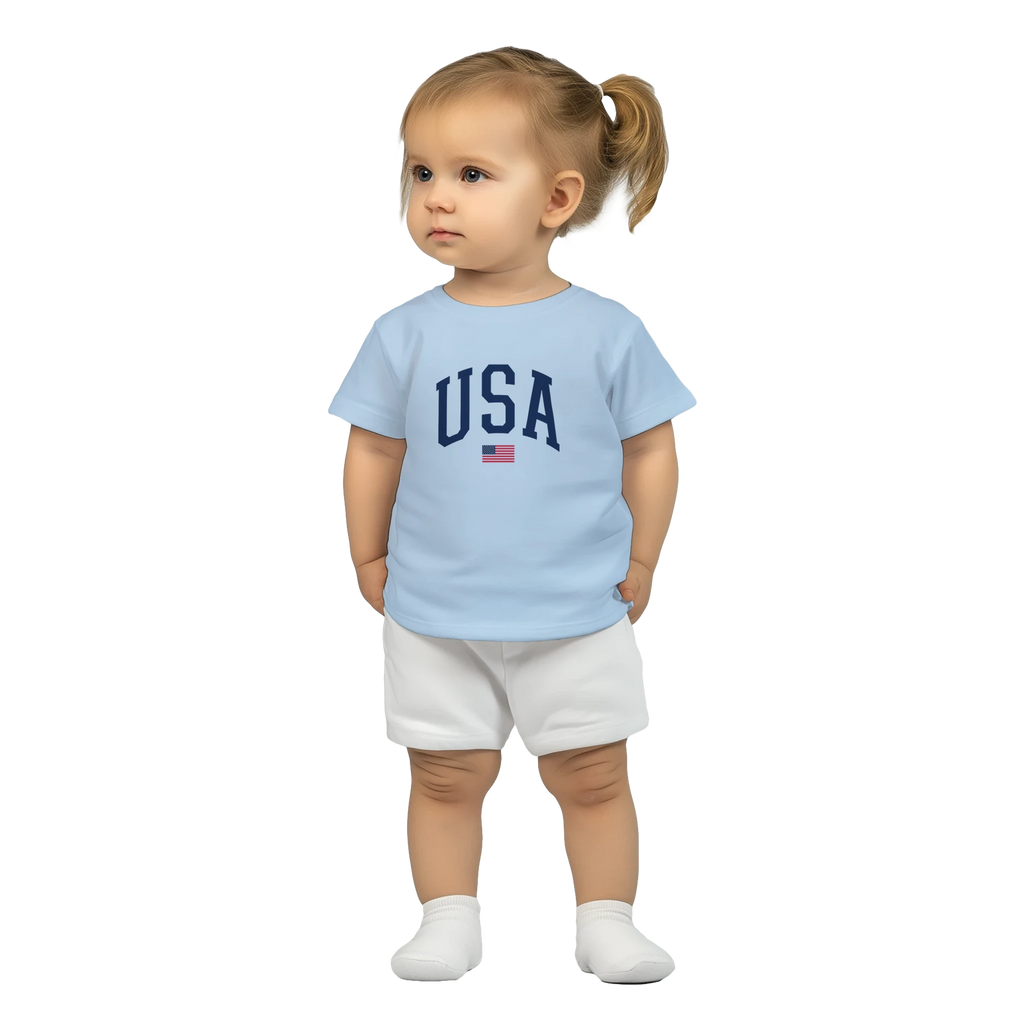 Child wearing a light blue t-shirt with 'USA' text and white shorts on a white background
