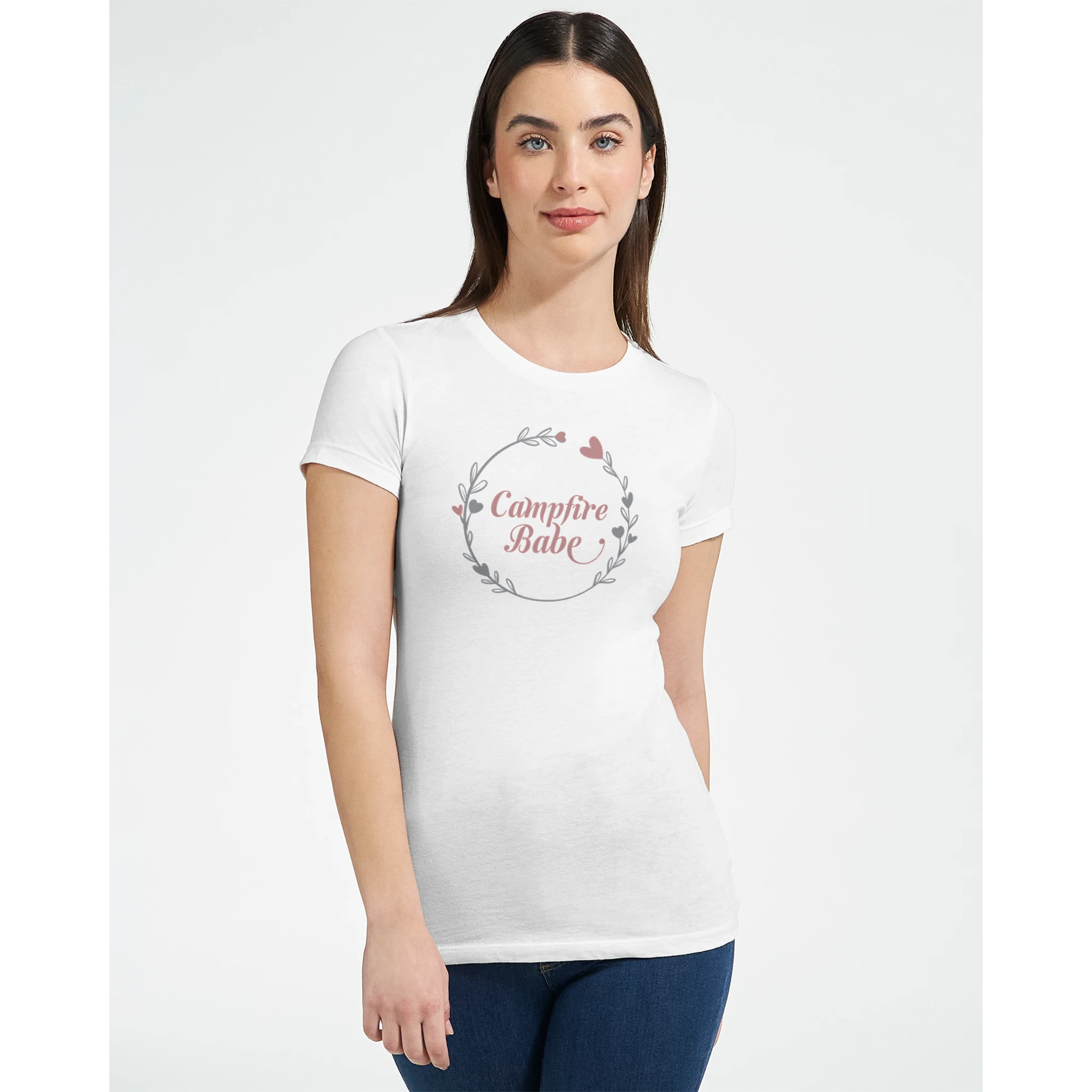 Woman wearing a white t-shirt with 'Campfire Baby' design on a plain background