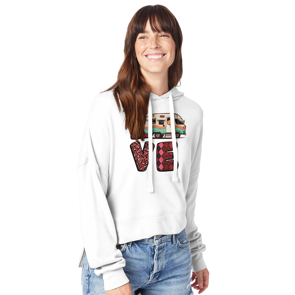 Woman wearing a white hoodie with a colorful Love design from the Love Collection on a white background