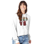 Woman wearing a white hoodie with a colorful Love design from the Love Collection on a white background
